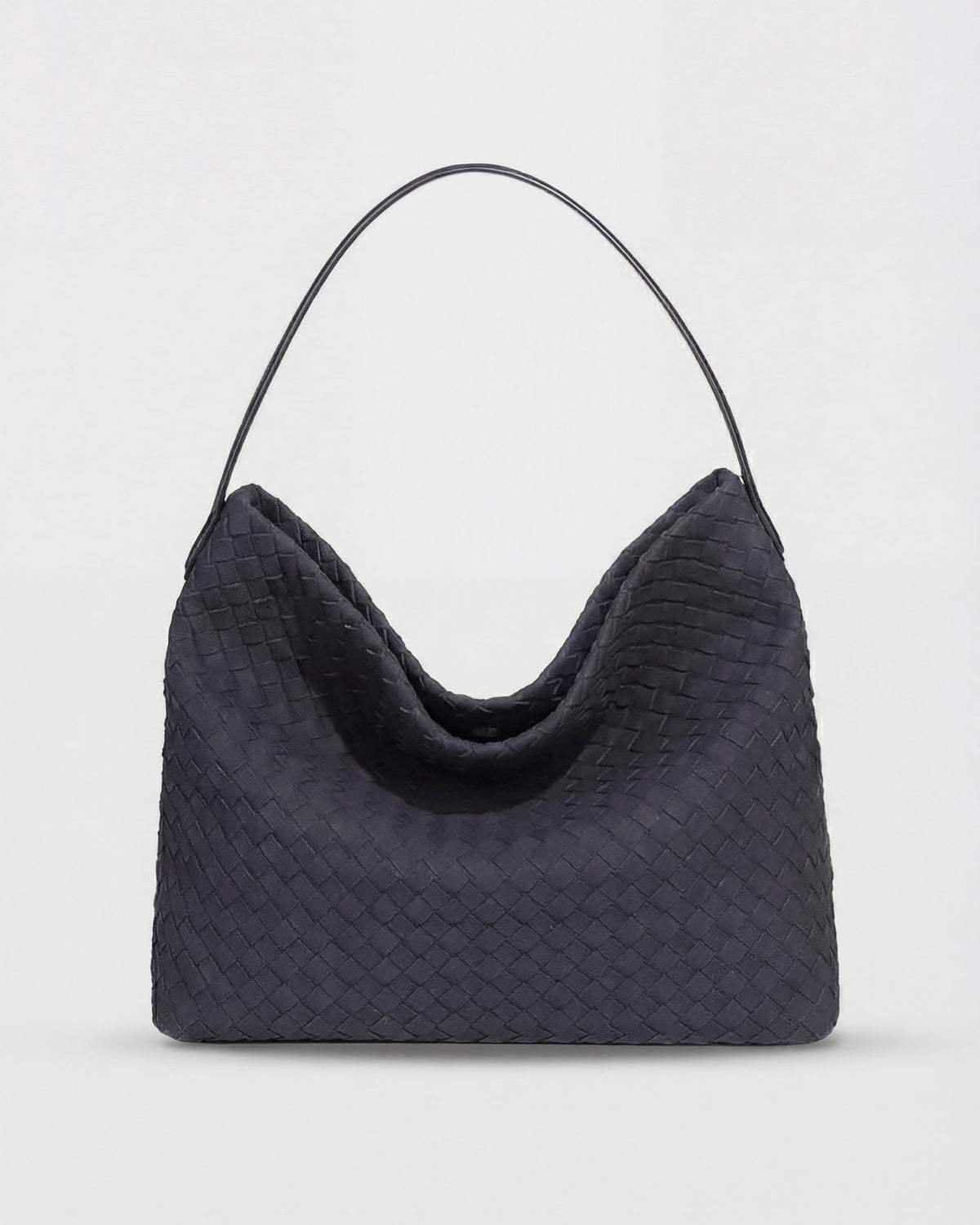 Elegant black suede tote bag by Lumina Wear featuring a spacious design and structured shape for versatile use.