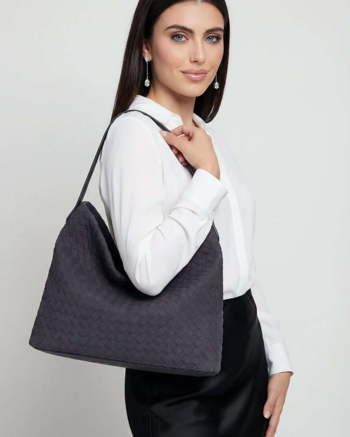 Victoria black suede tote bag by Lumina Wear, showcasing a spacious design with elegant craftsmanship and sleek style.