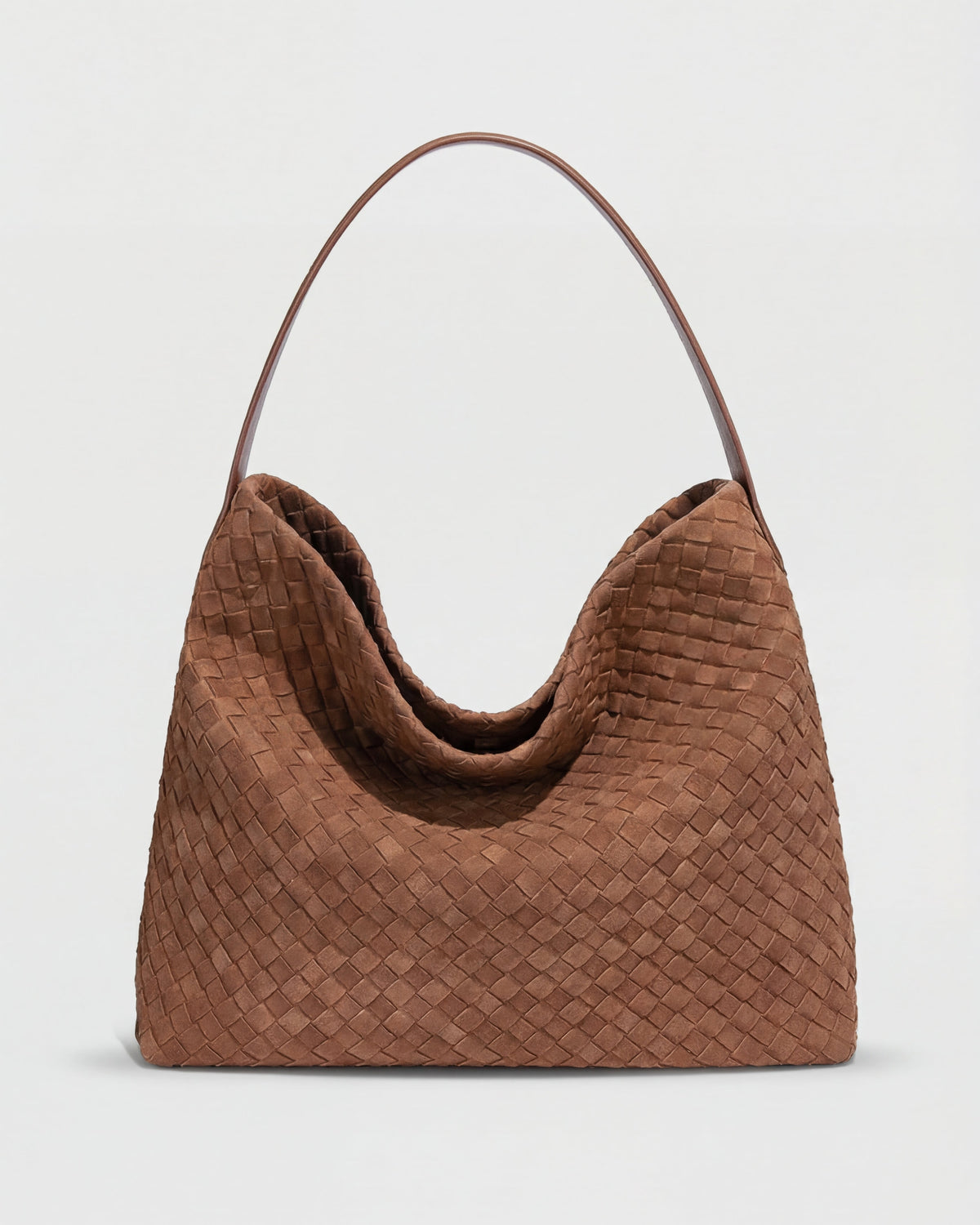 Elegant black suede tote bag by Lumina Wear featuring a spacious design and top handles, perfect for everyday use.