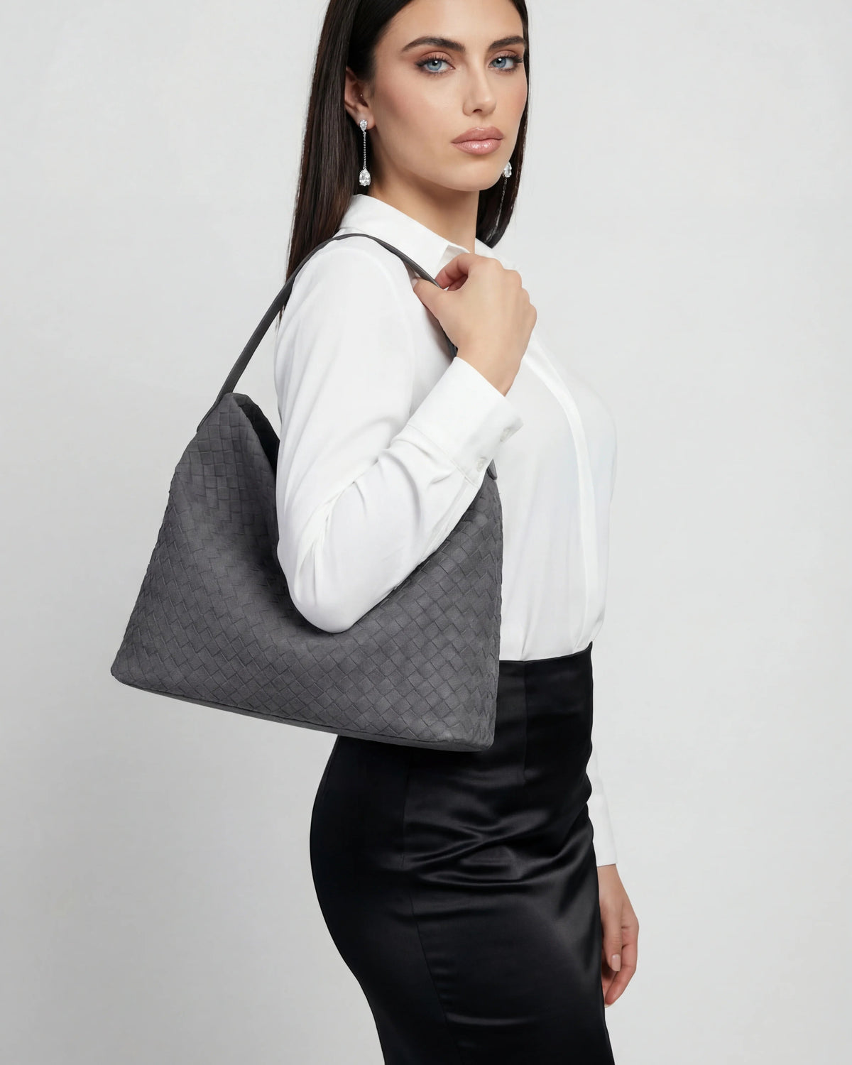 Elegant black suede tote bag by Lumina Wear featuring a spacious design, perfect for everyday use.