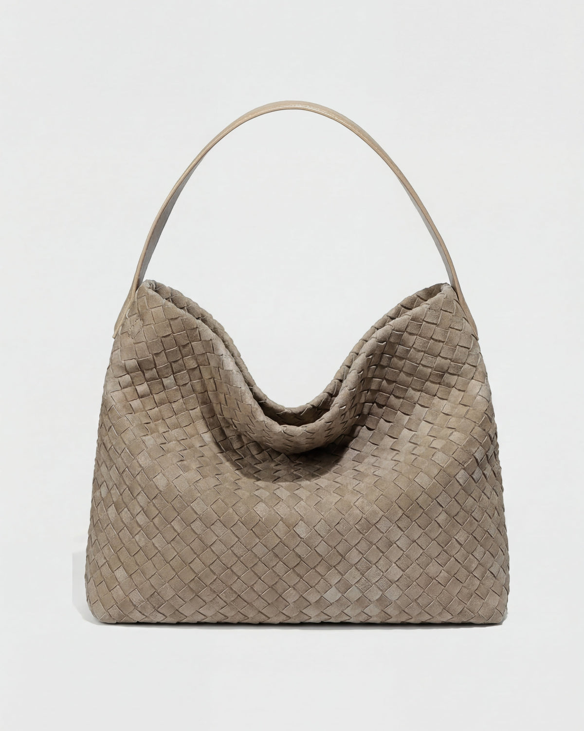 Elegant black suede tote bag by Lumina Wear featuring a spacious design and stylish hand-held silhouette.