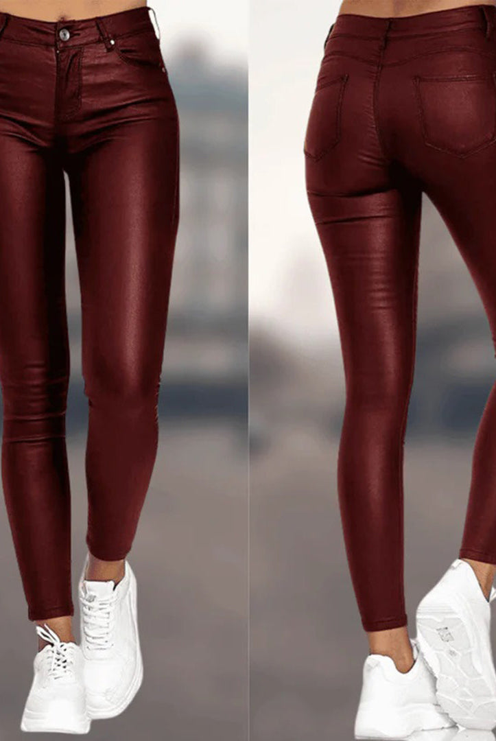 Elegant black Lumina Wear Victoria pants with a comfortable fit, shown laid flat against a white background.