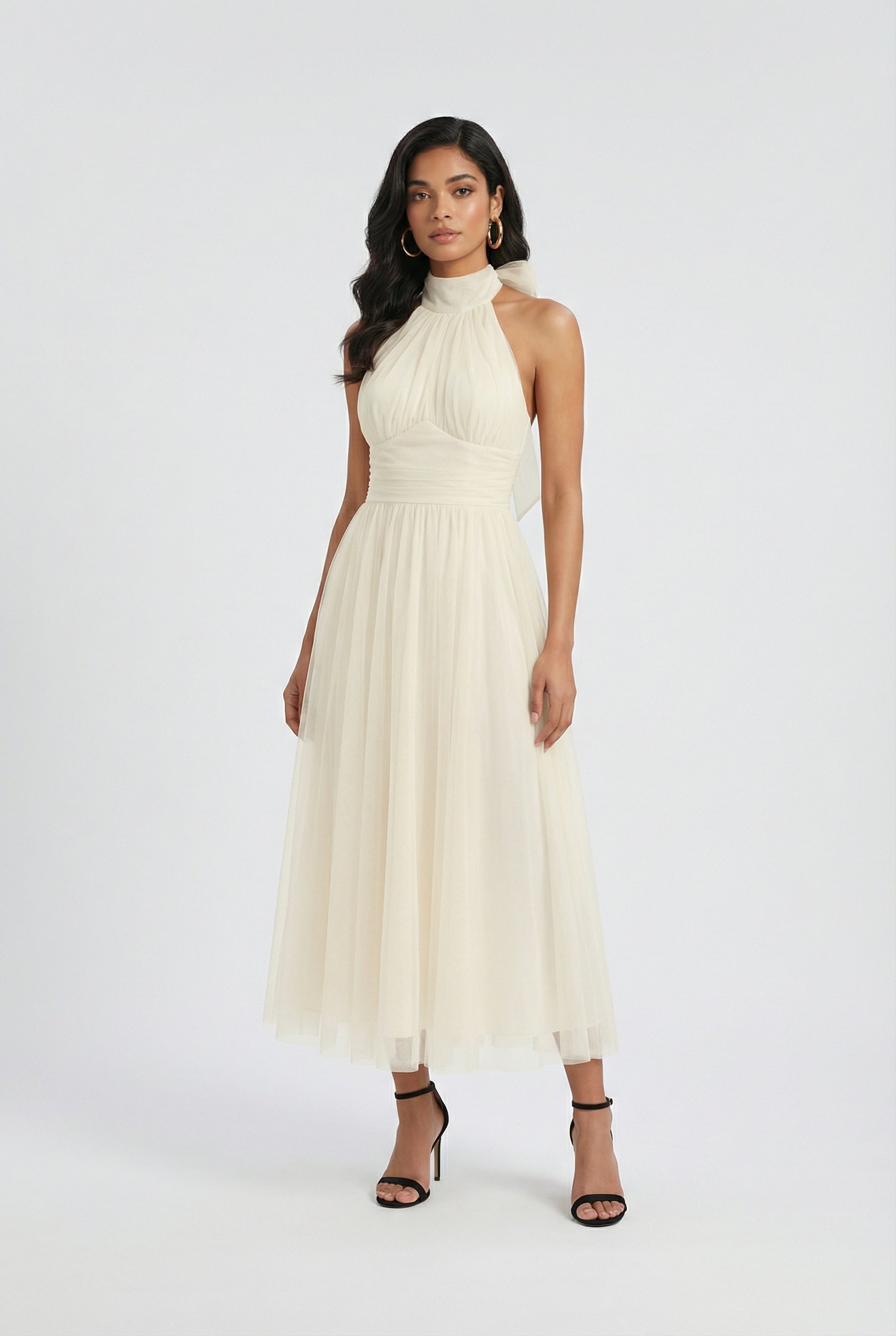 Elegant cream midi dress by Lumina Wear with a flowy design, showcased on a model in a stylish, feminine silhouette.