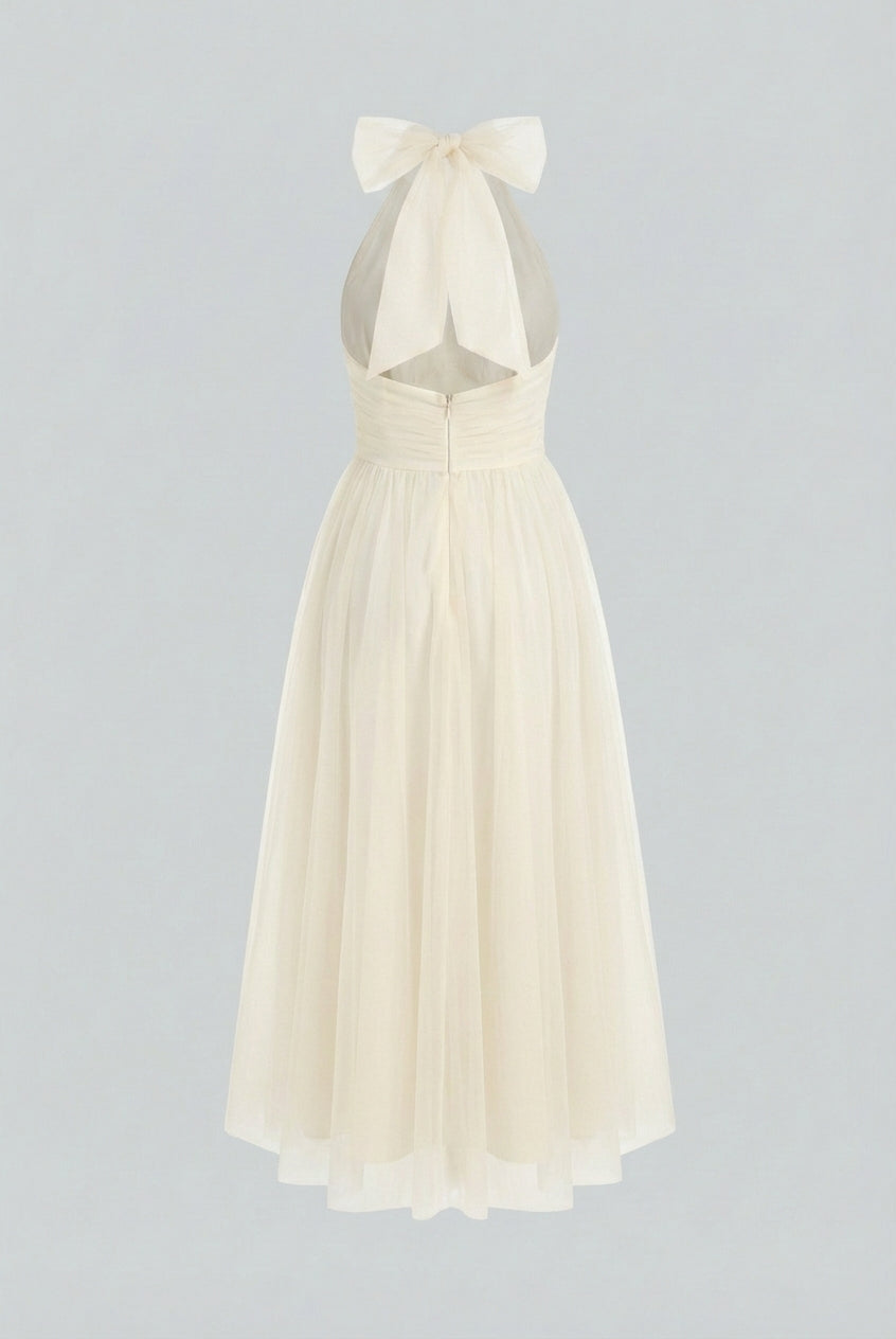 Elegant cream midi dress by Lumina Wear featuring a flowy design, perfect for sophisticated occasions.
