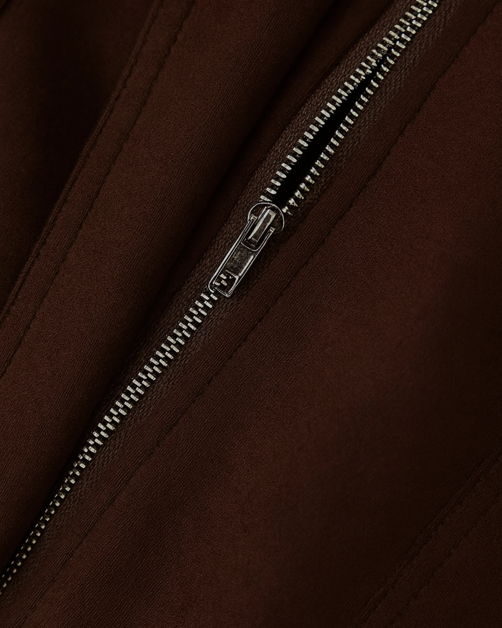 Elegant dark brown bomber jacket by Lumina Wear featuring versatile style and classic fit, shown on a model.