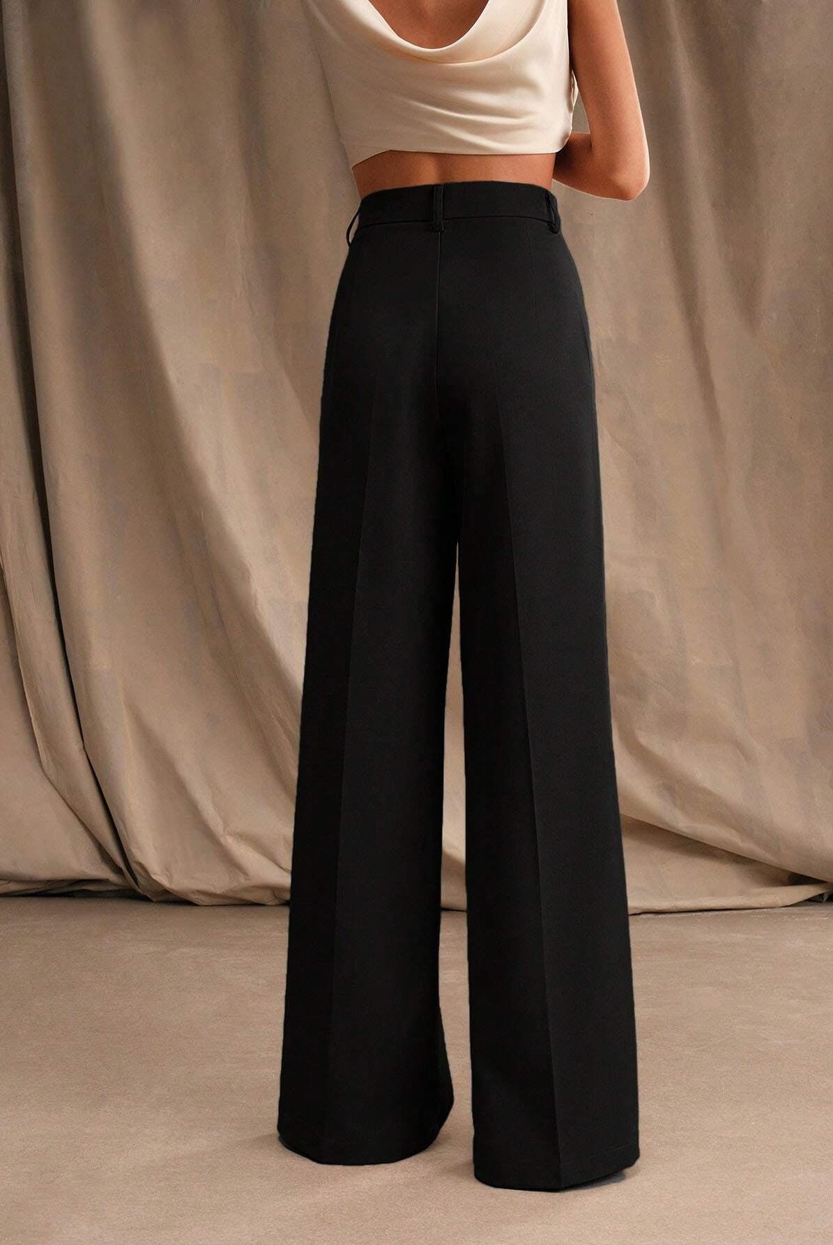 Black Victoria high waist wide leg trousers by Lumina Wear, showcasing a stylish, elegant fit and flowing silhouette.