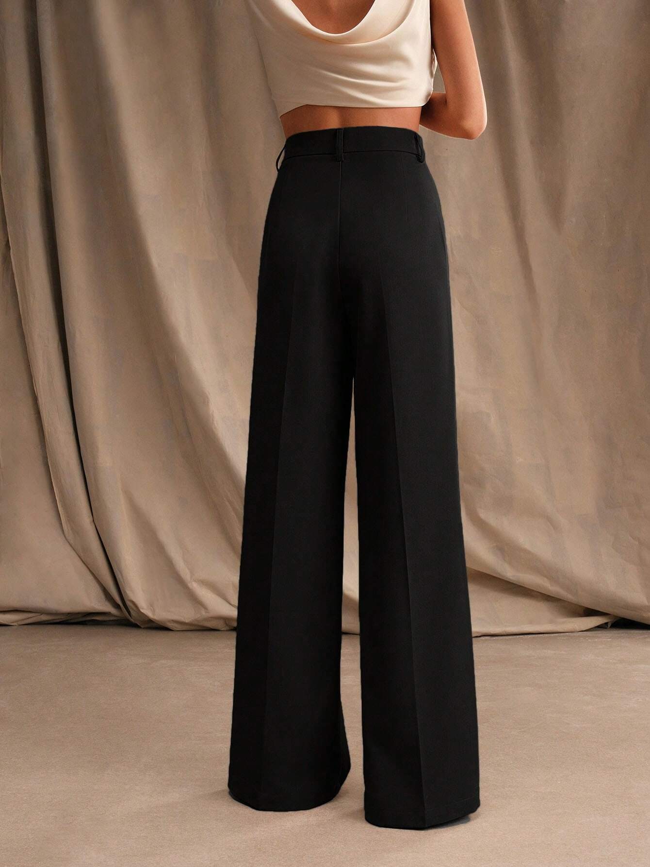 Black Victoria high waist wide leg trousers by Lumina Wear, showcasing a stylish, elegant fit and flowing silhouette.