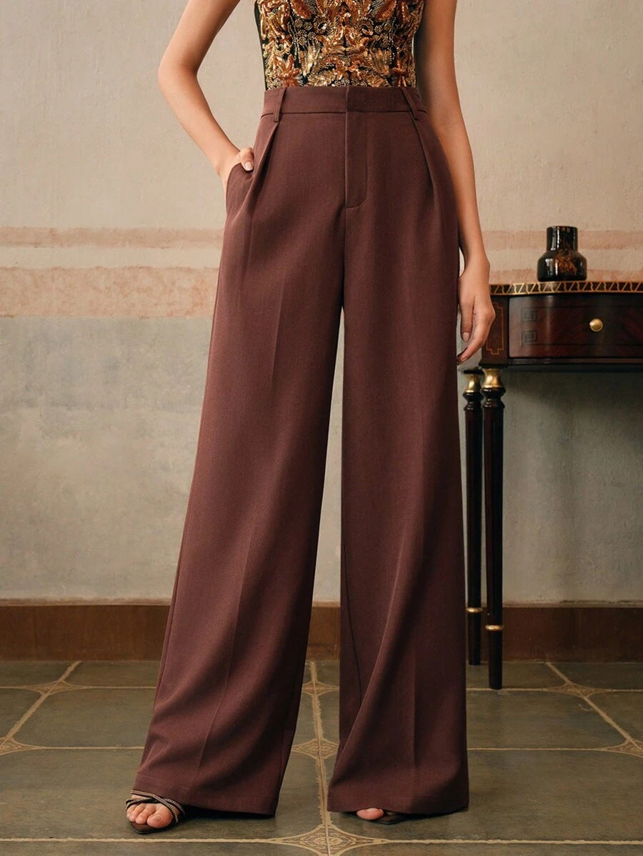 Black Victoria Lumina Wear high waist wide leg trousers shown on a model featuring a stylish, elegant fit and flowy wide-leg design.