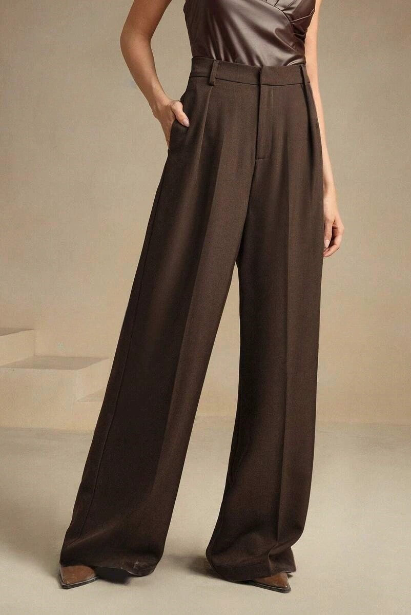 Black Victoria Lumina Wear high waist wide leg trousers, stylish and elegant, showcased on a model in a fashion setting.