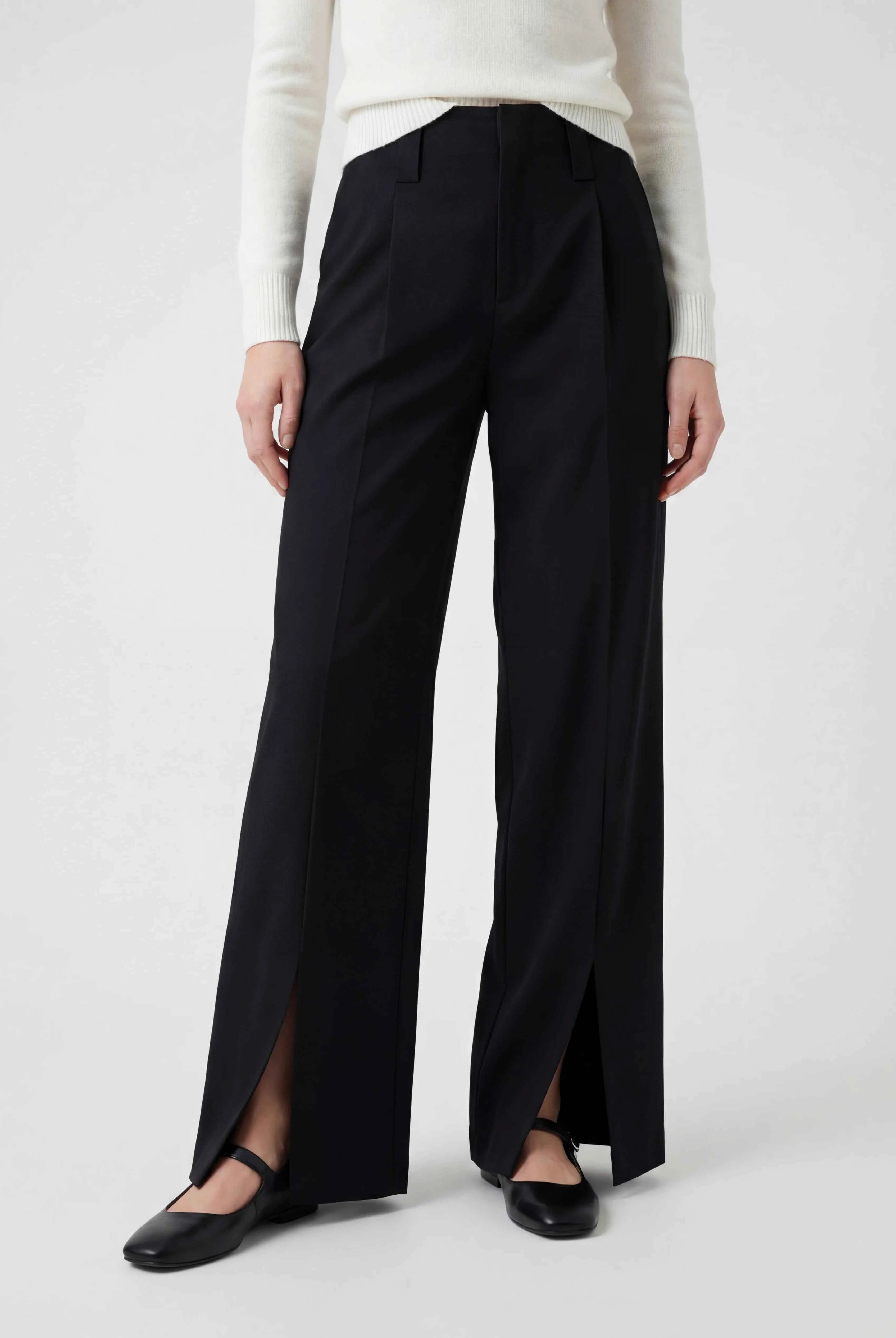 Elegant black high-waisted women's trousers with pleats by Lumina Wear, featuring a tailored fit and classic design.