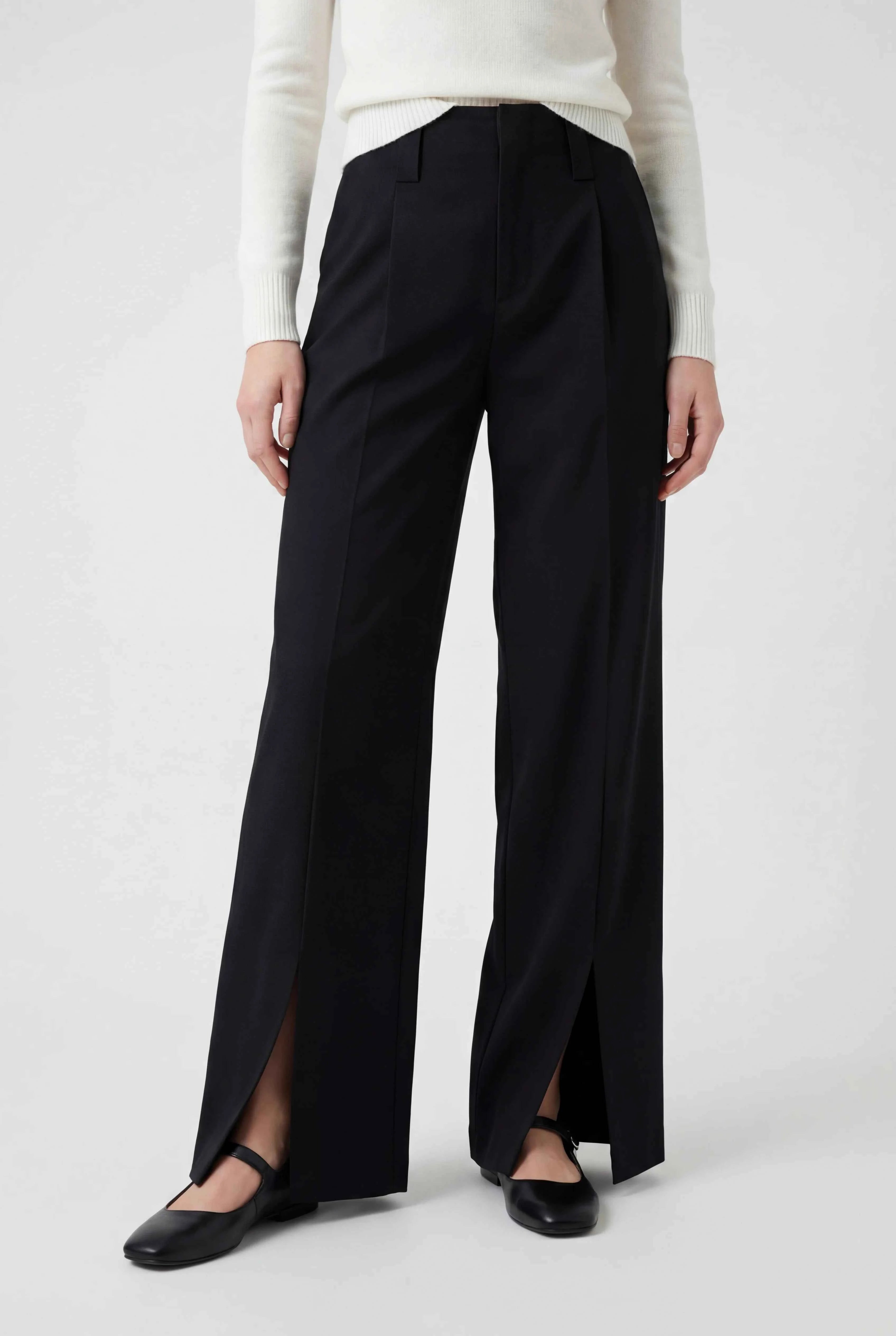 Elegant black high-waisted women's trousers with pleats by Lumina Wear, featuring a tailored fit and classic design.