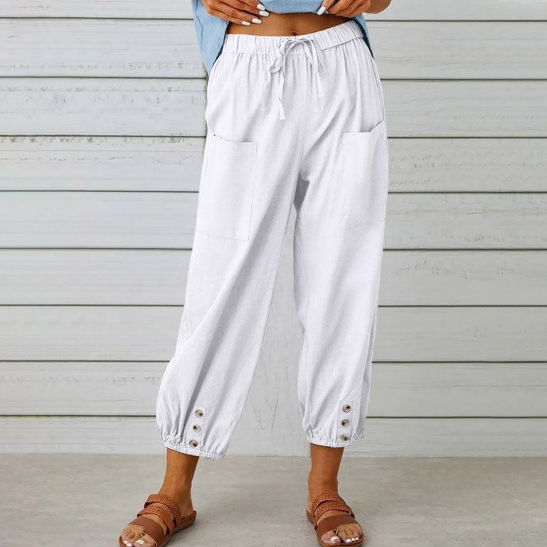 White Victoria Lumina Wear lightweight wide-leg trousers, elegant and flowing, shown on a model with a relaxed fit.