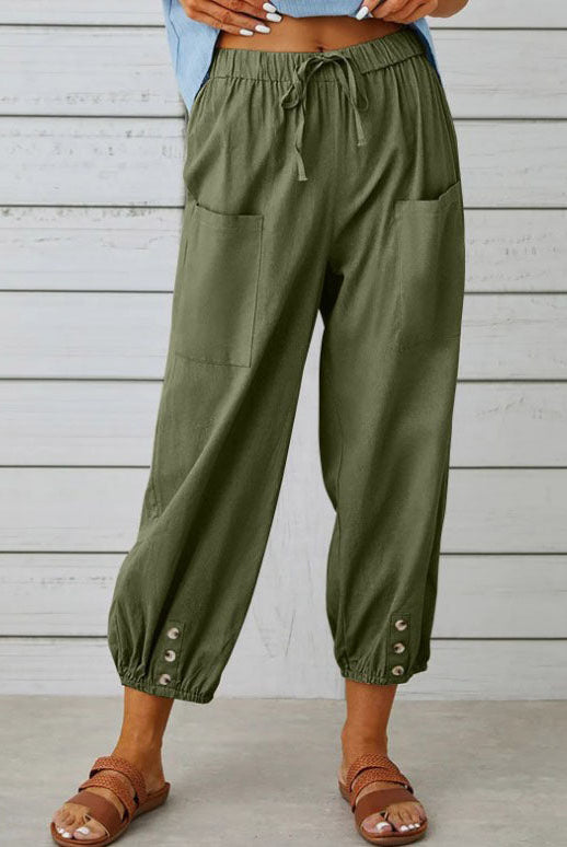 White Victoria Lumina Wear lightweight wide-leg trousers with a relaxed fit, styled for elegant, comfortable wear.