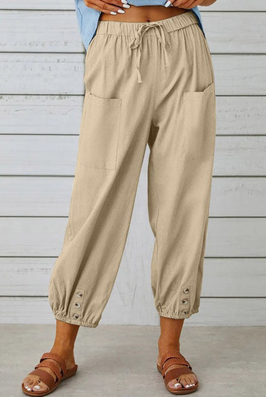 White lightweight wide-leg trousers by Lumina Wear, featuring a relaxed fit and elegant style in a natural fabric.