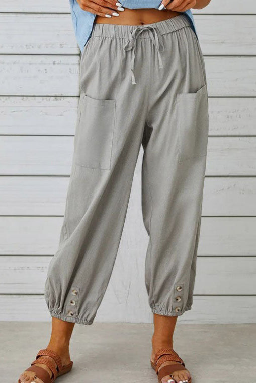 White Victoria wide-leg trousers by Lumina Wear, lightweight and elegant, shown on a model with a relaxed fit and tailored design.