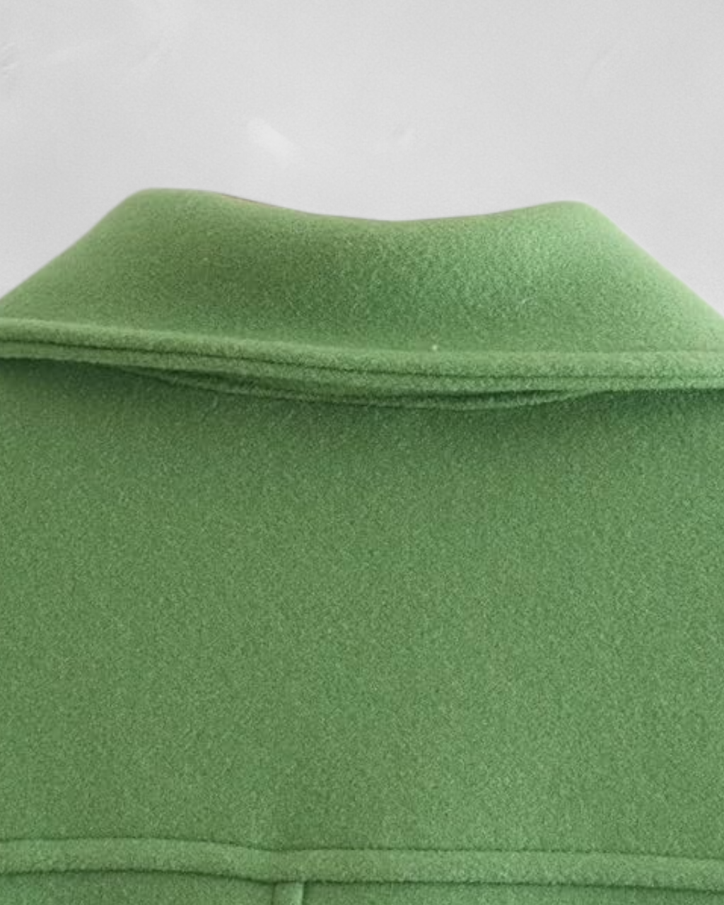 Elegant green long sleeve jacket with button closure from Lumina Wear, stylish and tailored for a sophisticated look.