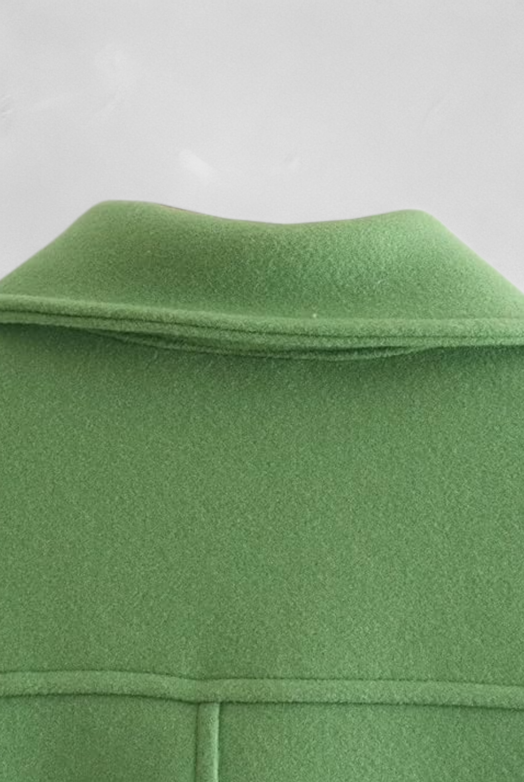 Lumina Wear Victoria elegant green long sleeve jacket with button closure, stylish and tailored for a sophisticated look.