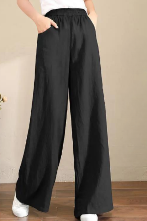 Black Victoria loose-fitting trousers by Lumina Wear, featuring a chic, elegant design and relaxed fit for stylish comfort.