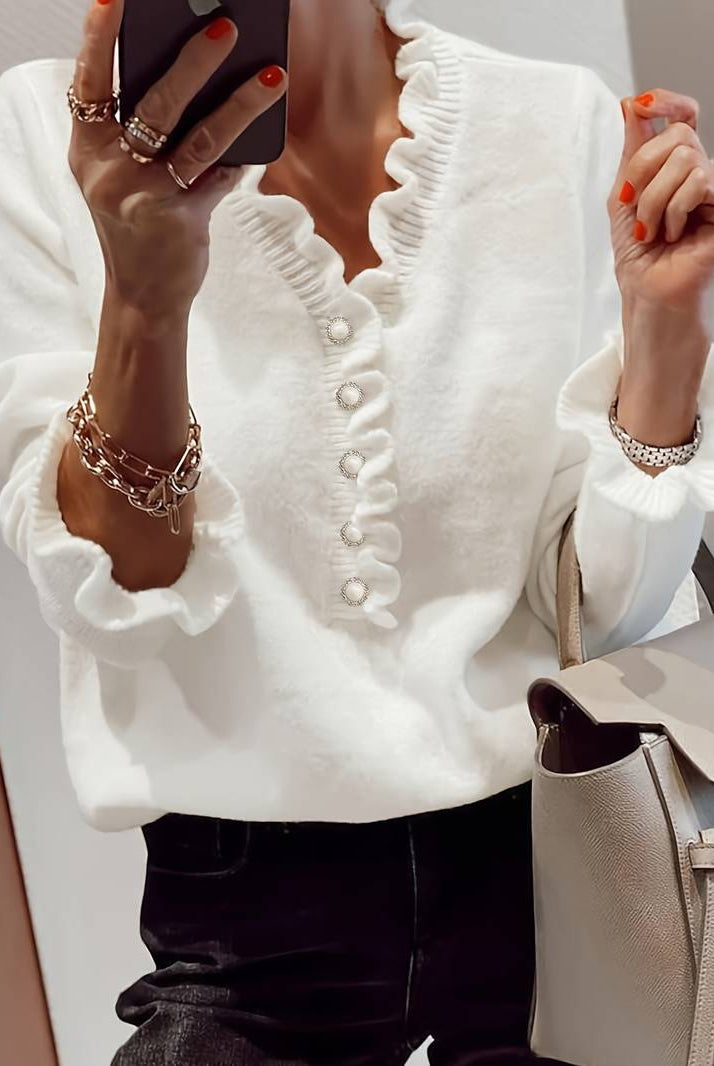 Elegant women's blouse by Lumina Wear featuring ruffle details and decorative buttons, showcased in a stylish front view.