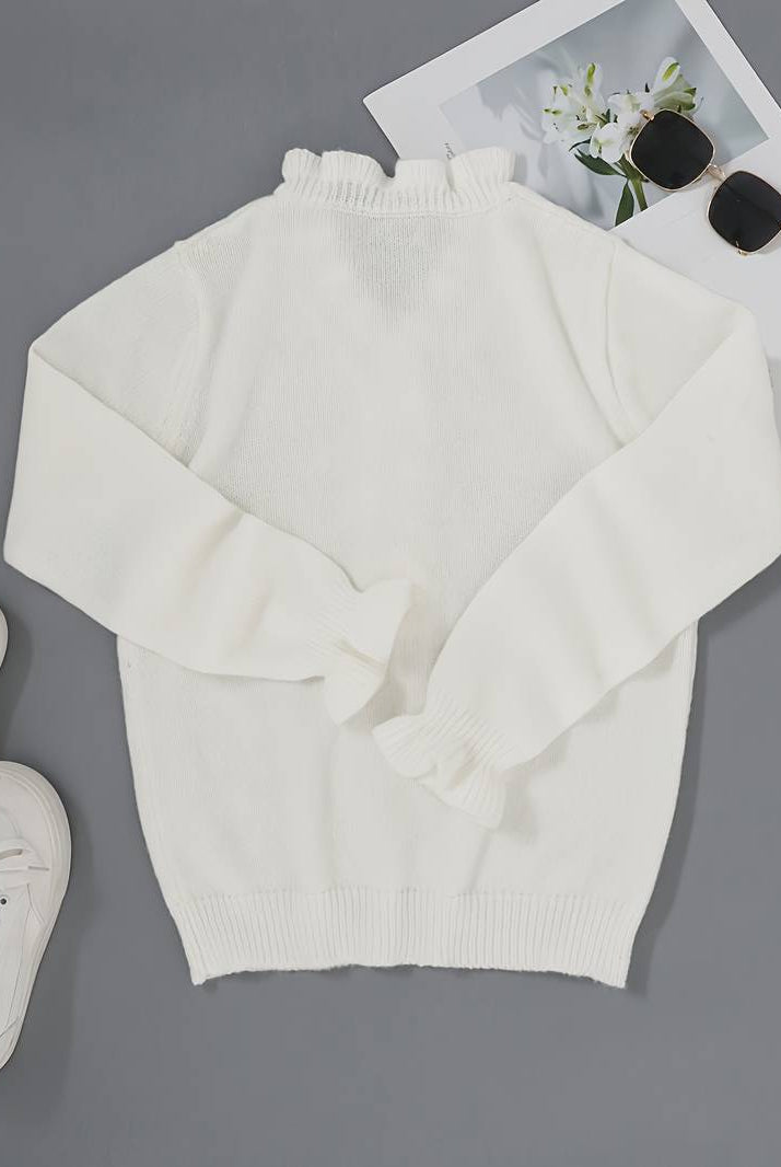 Victoria women's blouse by Lumina Wear featuring elegant ruffle design and decorative buttons, stylish and feminine.