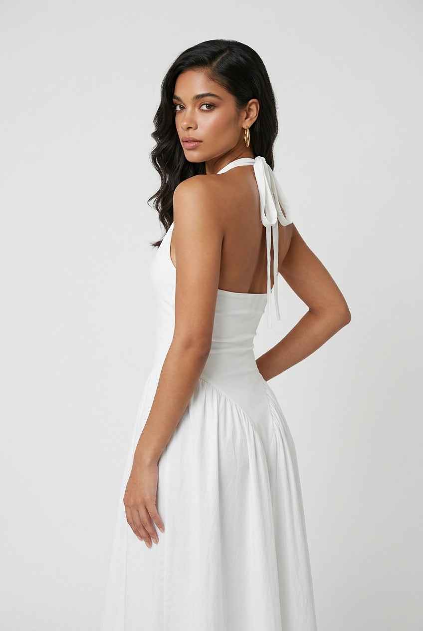 Elegant white midi dress by Lumina Wear, tailored fit with clean lines, showcased on a model against a neutral background.
