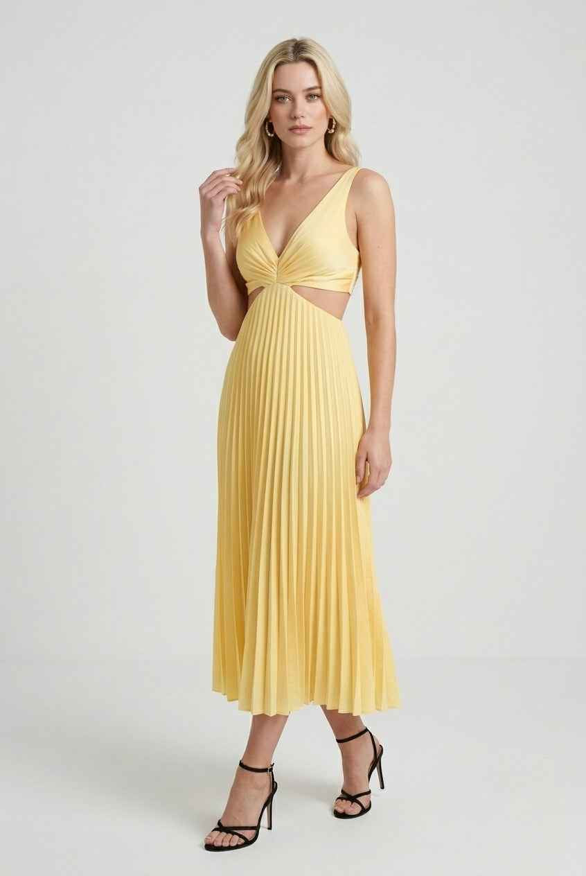 Yellow flowing pleated dress by Lumina Wear, elegant silhouette, women’s dress with a soft, flowing fabric and stylish design.