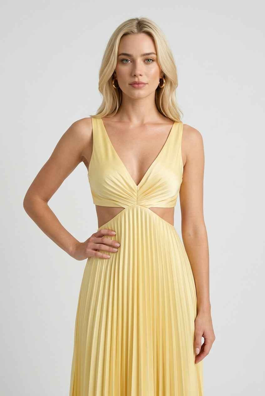Victoria yellow pleated dress by Lumina Wear, flowing elegant silhouette for women's fashion, displayed on a model.