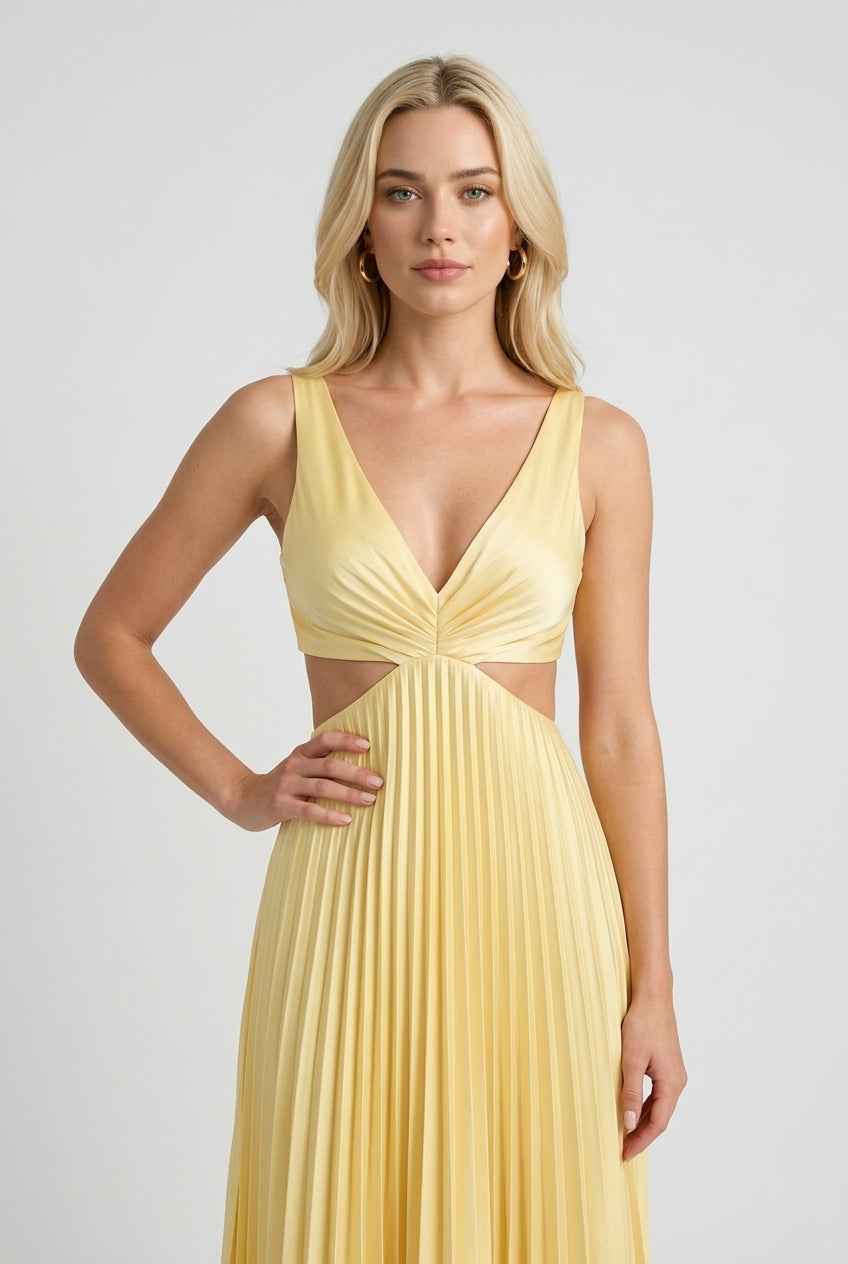 Victoria yellow pleated dress by Lumina Wear, flowing elegant silhouette for women's fashion, displayed on a model.