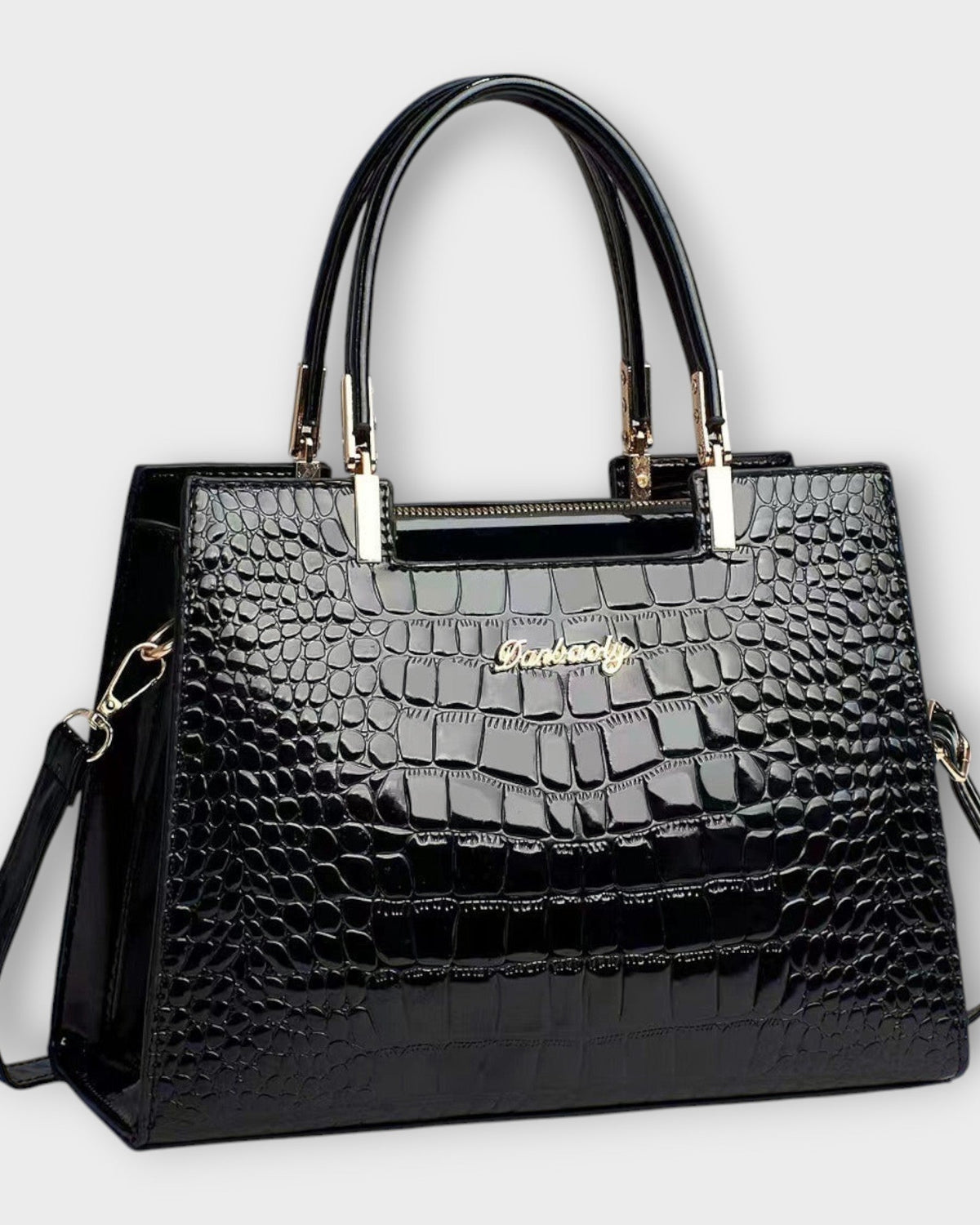 Black Victoria Lumina crocodile pattern handbag with glossy finish and structured design, showcasing elegant craftsmanship.