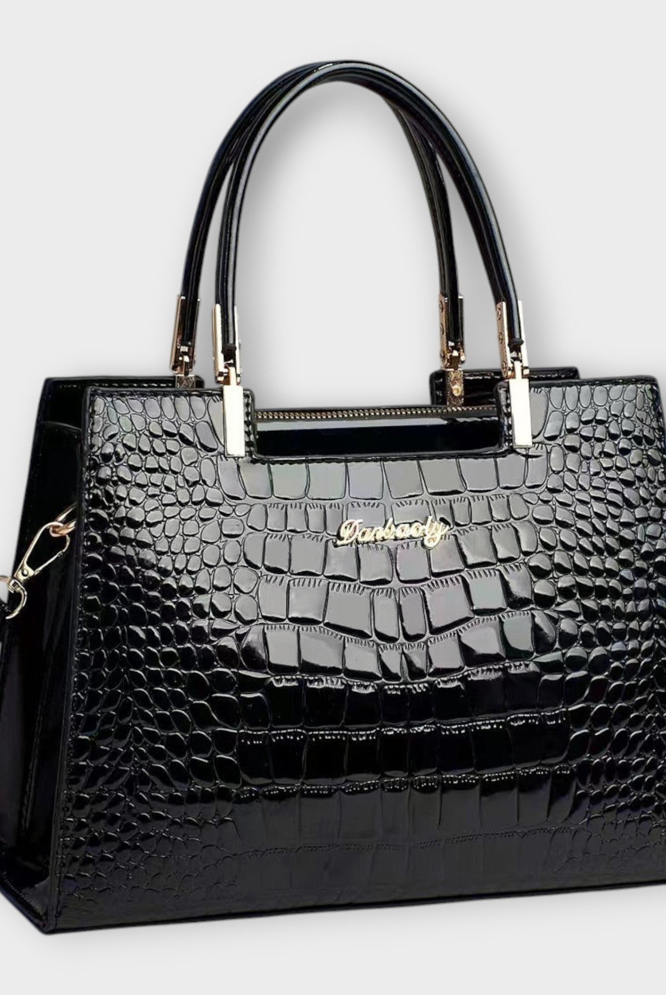 Black Victoria Lumina glossy crocodile pattern handbag with structured design, showcasing elegant craftsmanship and textured finish.