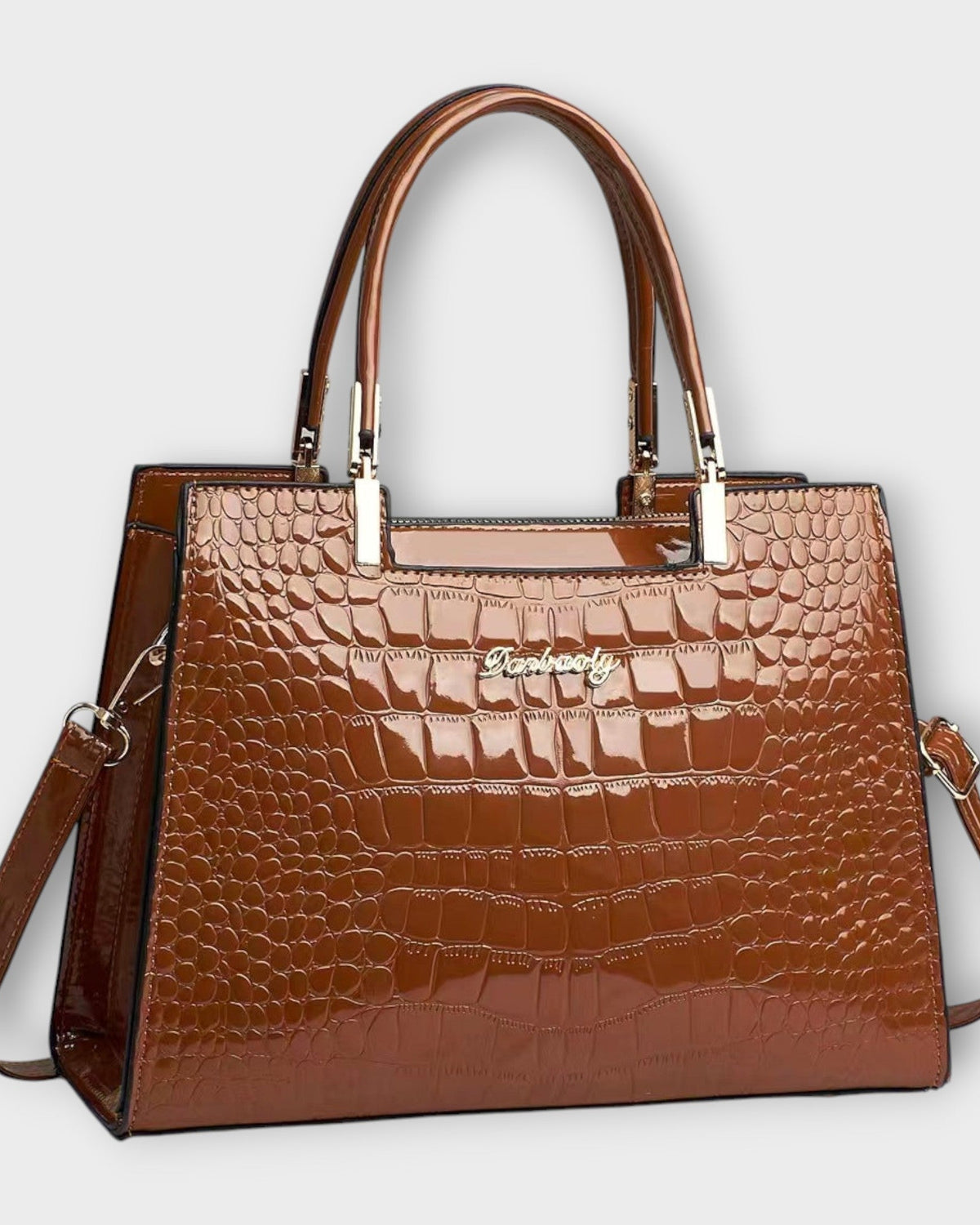 Lumina Victoria glossy crocodile pattern handbag with structured design in black, featuring sleek, elegant craftsmanship.