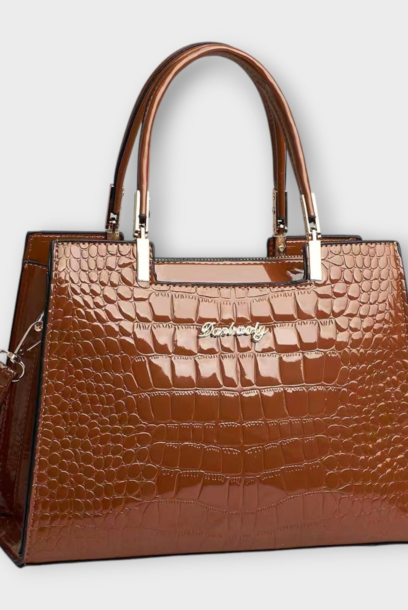 Black Victoria Lumina glossy crocodile pattern handbag with structured design, featuring top handles and elegant finish.