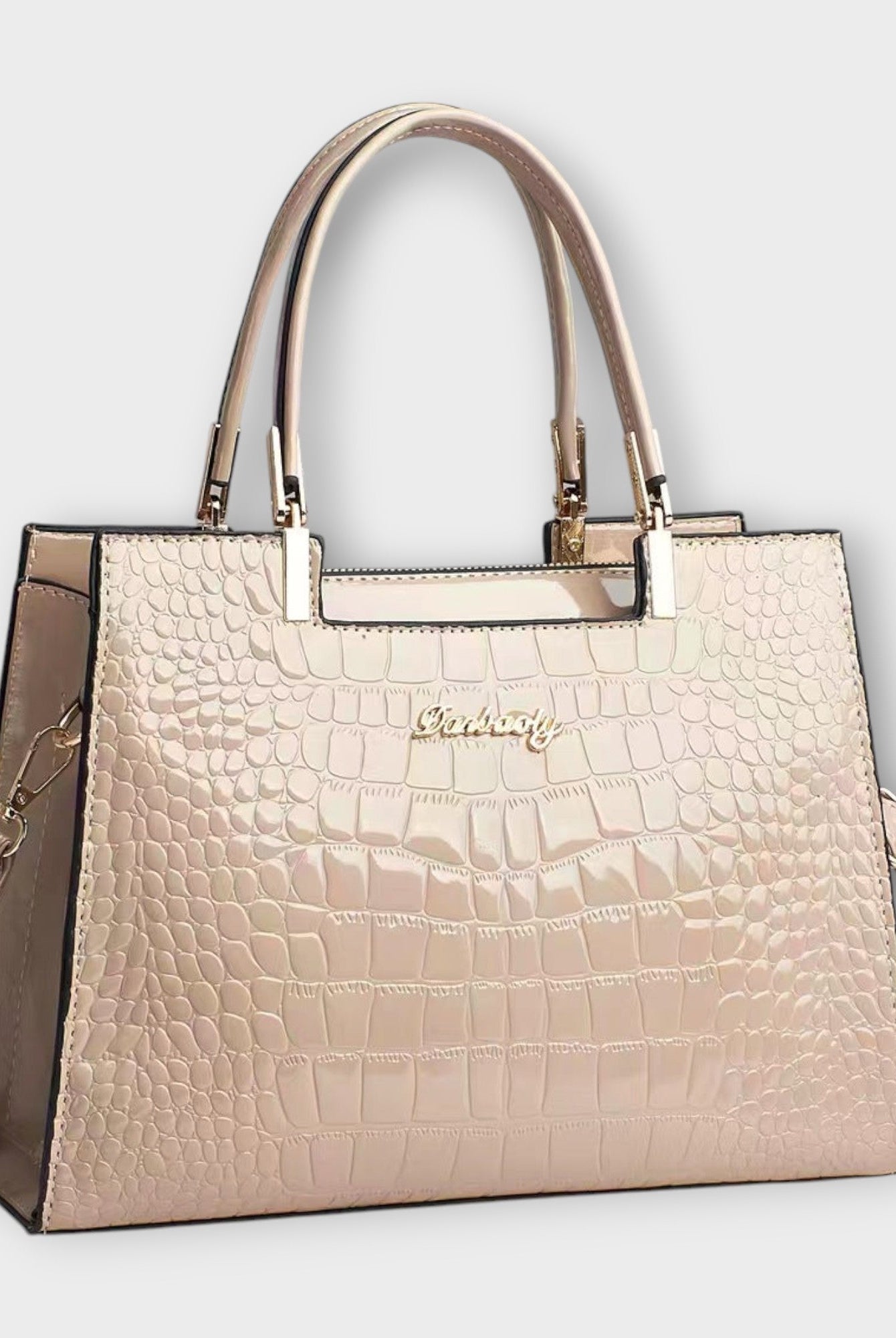 Black Victoria Lumina handbag with glossy crocodile pattern and structured design, showcasing its elegant, textured surface.
