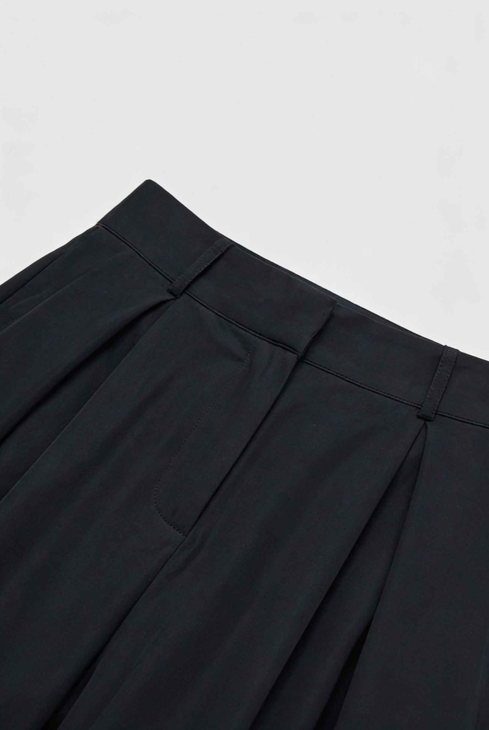 Black Victoria high-waisted wide-leg trousers by Lumina Wear featuring an elegant fit, styled with a relaxed and sophisticated look.