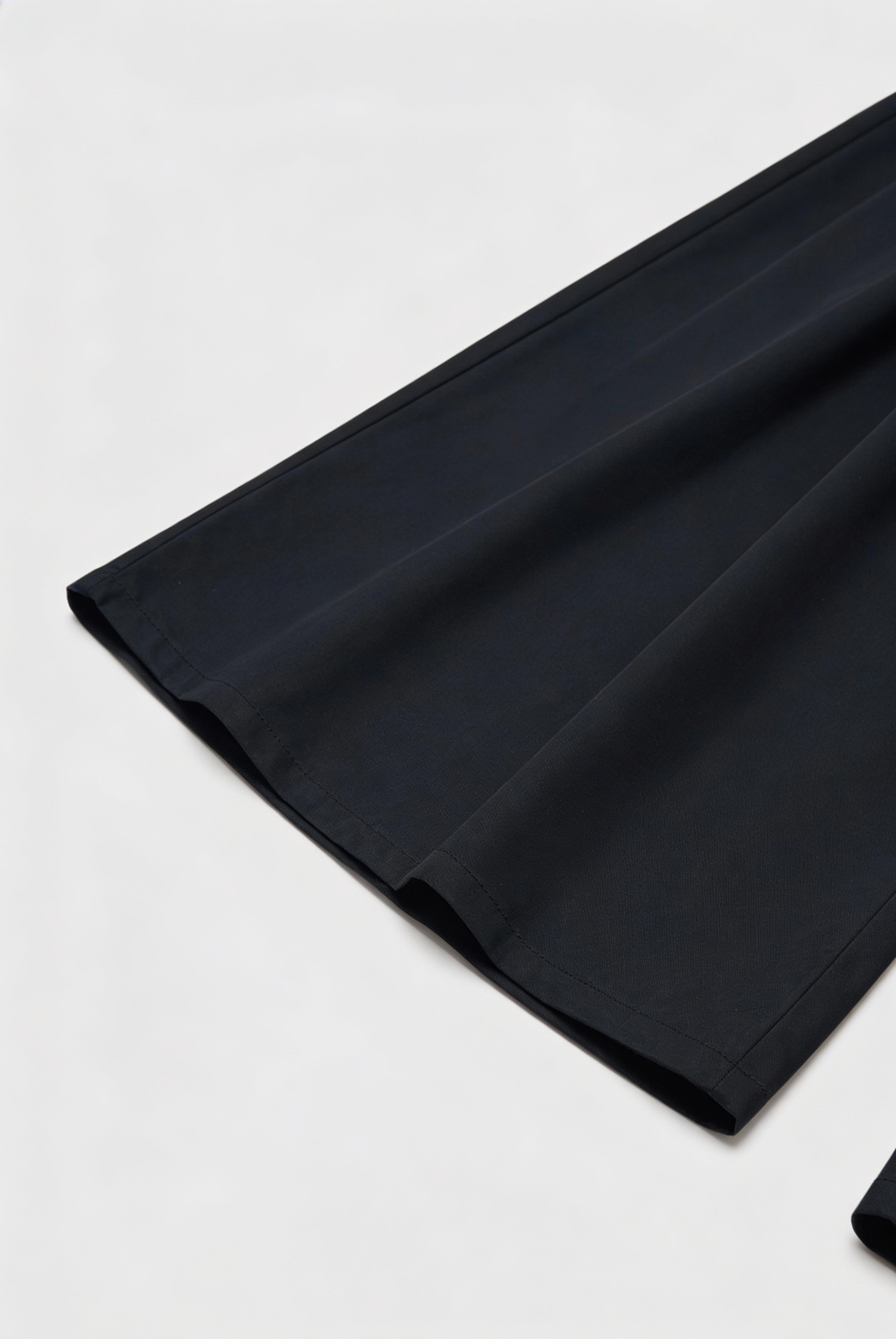 Black Victoria high-waisted wide-leg trousers from Lumina Wear, showcasing an elegant fit and relaxed, flowing silhouette.