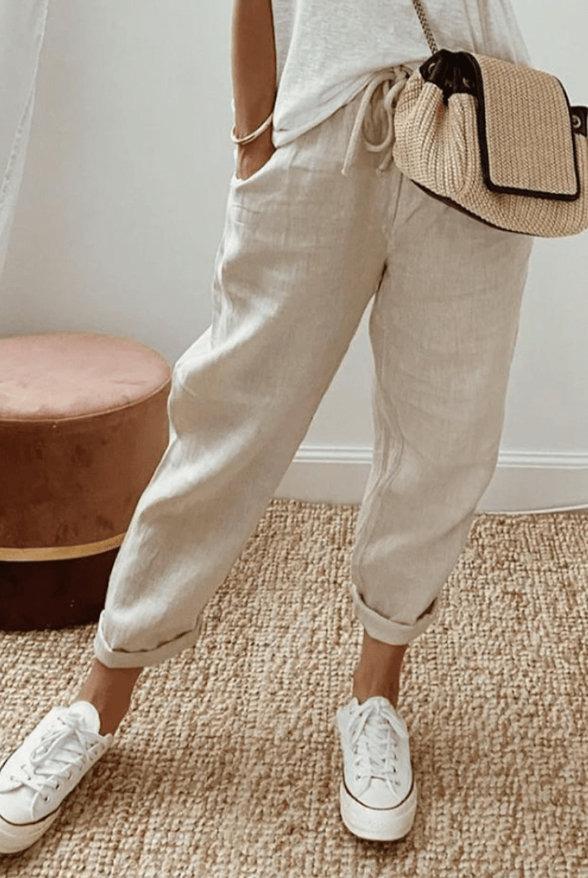 Light beige Lumina Wear Victoria casual trousers with a relaxed fit, lightweight fabric, and subtle print detail.