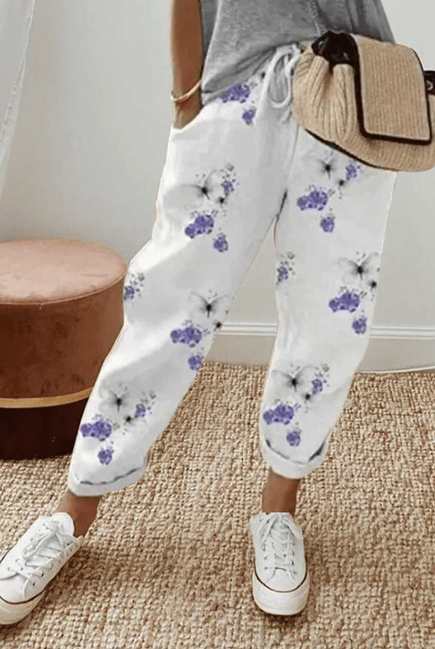Lightweight beige casual trousers with relaxed fit from Lumina Wear, featuring subtle print detail and comfortable fabric.