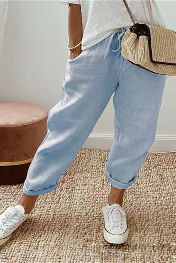 Lightweight beige casual trousers with a relaxed fit from Lumina Wear, featuring a subtle print and comfortable design.