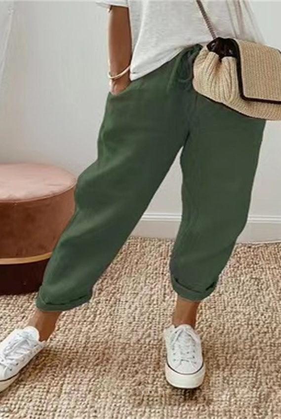 Lightweight beige casual trousers with relaxed fit from Lumina Wear, featuring a subtle print and comfortable style.