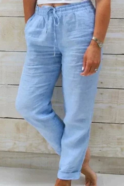 Light beige Lumina Wear Victoria summer trousers with elastic waist, lightweight fabric, and relaxed fit in size S.