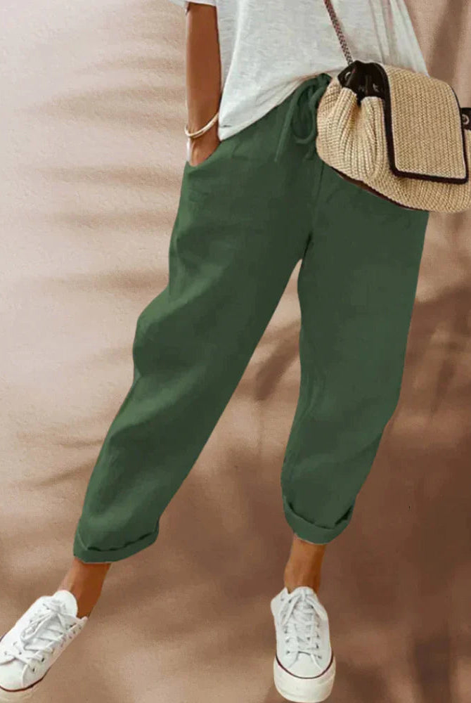 Lightweight black casual women's pants with elastic waist from Lumina Wear, shown with beige background.