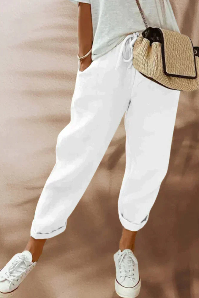 Women's lightweight black casual pants with elastic waist from Lumina Wear, shown in beige color, relaxed fit for everyday comfort.