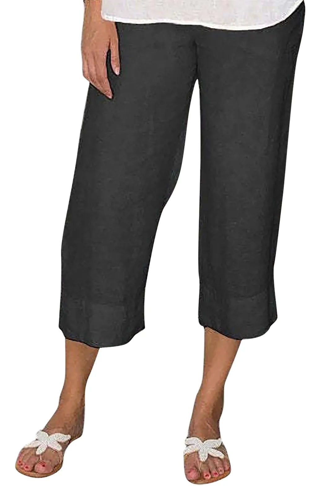 Victoria beige linen trousers by Lumina Wear with relaxed fit and drawcord, shown laid flat on a neutral background.