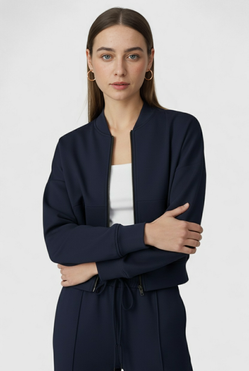 Victoria Lumina Wear relaxed fit dark blue activewear set with zippered accents, includes sweatpants and sweatshirt.