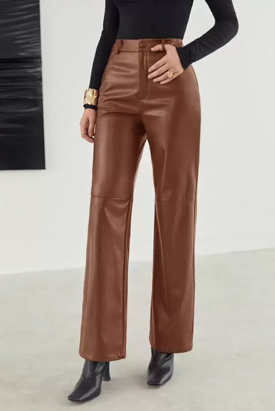 Victoria Lumina women's slim fit black leather trousers with soft finish, shown on a model. Stylish and form-fitting design.