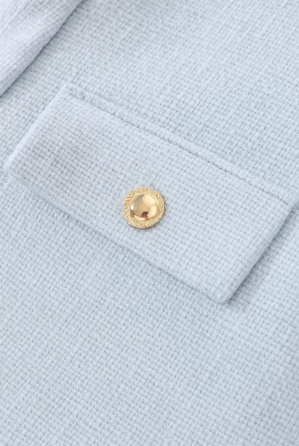Light blue women's short jacket from Lumina Wear, stylish design with versatile look, perfect for casual and layered outfits.