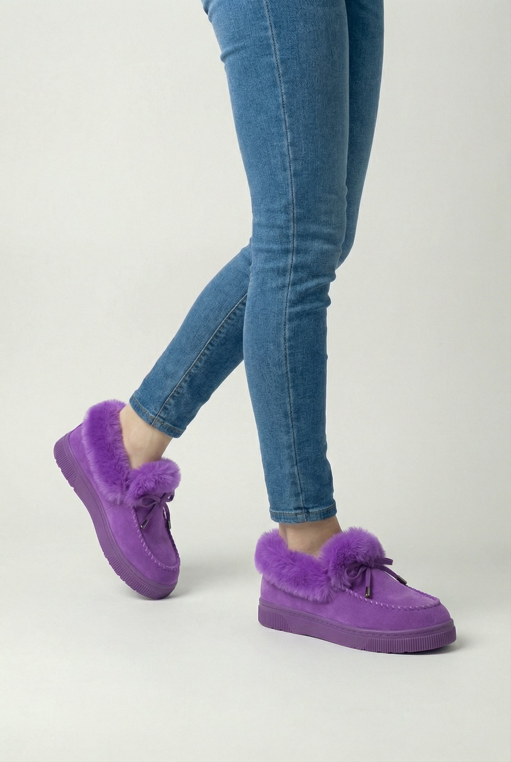Victoria Lumina Wear stylish purple winter boots with comfortable fit, featuring a cozy design and durable sole.