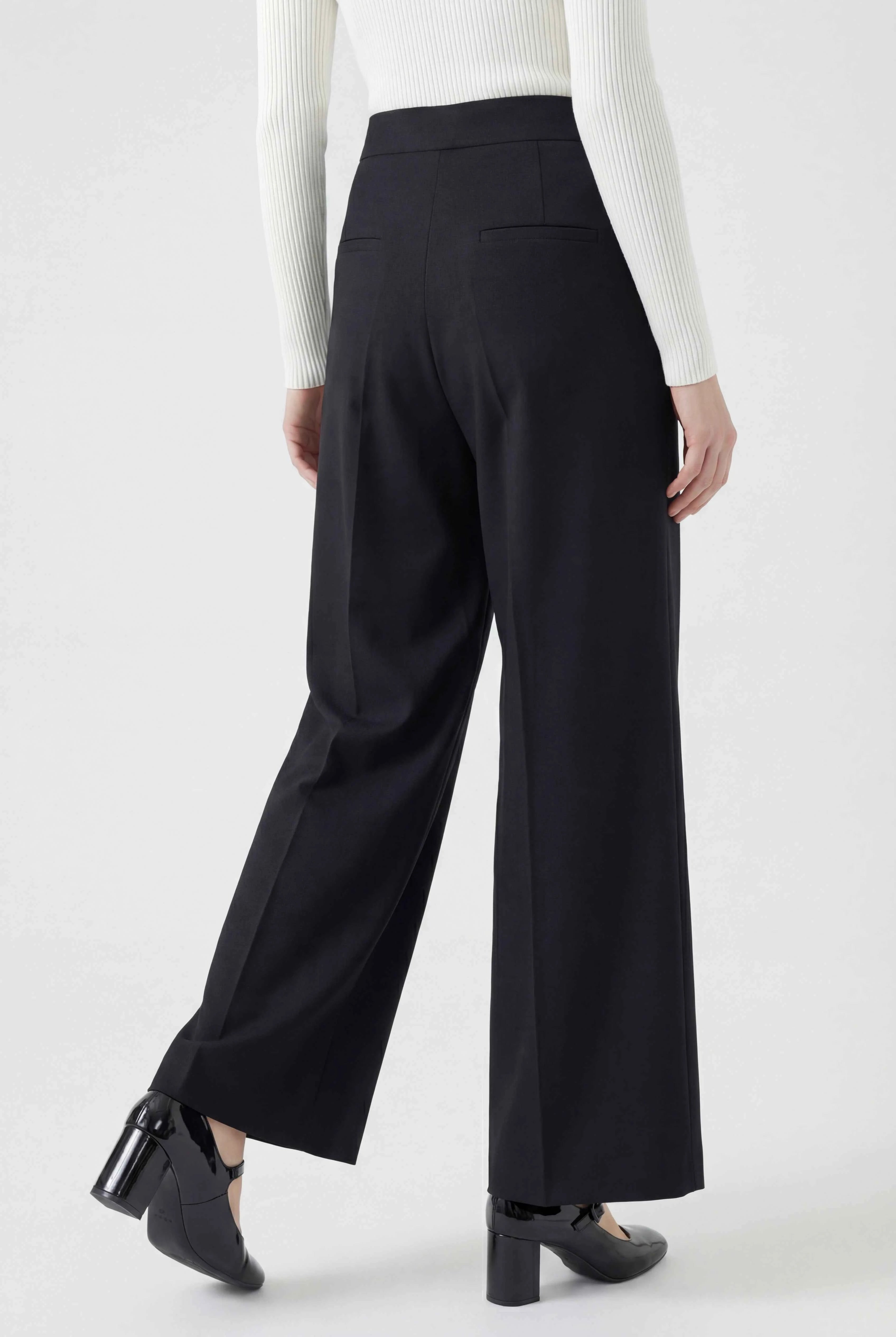 Black high-waisted tailored women's trousers by Lumina Wear, featuring a comfortable fit and sleek design.