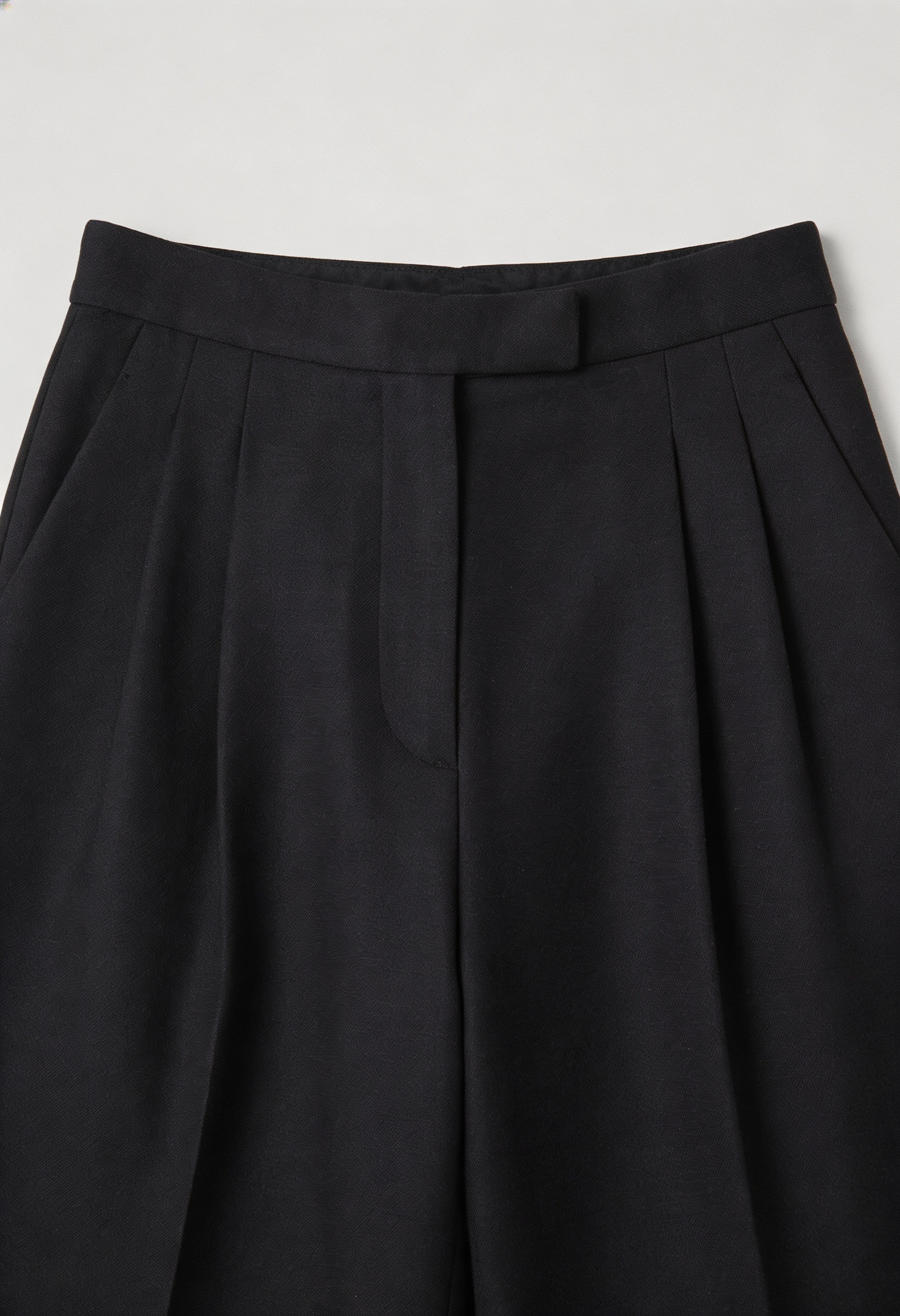 Victoria Lumina high-waisted black women's trousers with tailored fit and comfort, featuring a sleek, modern design.