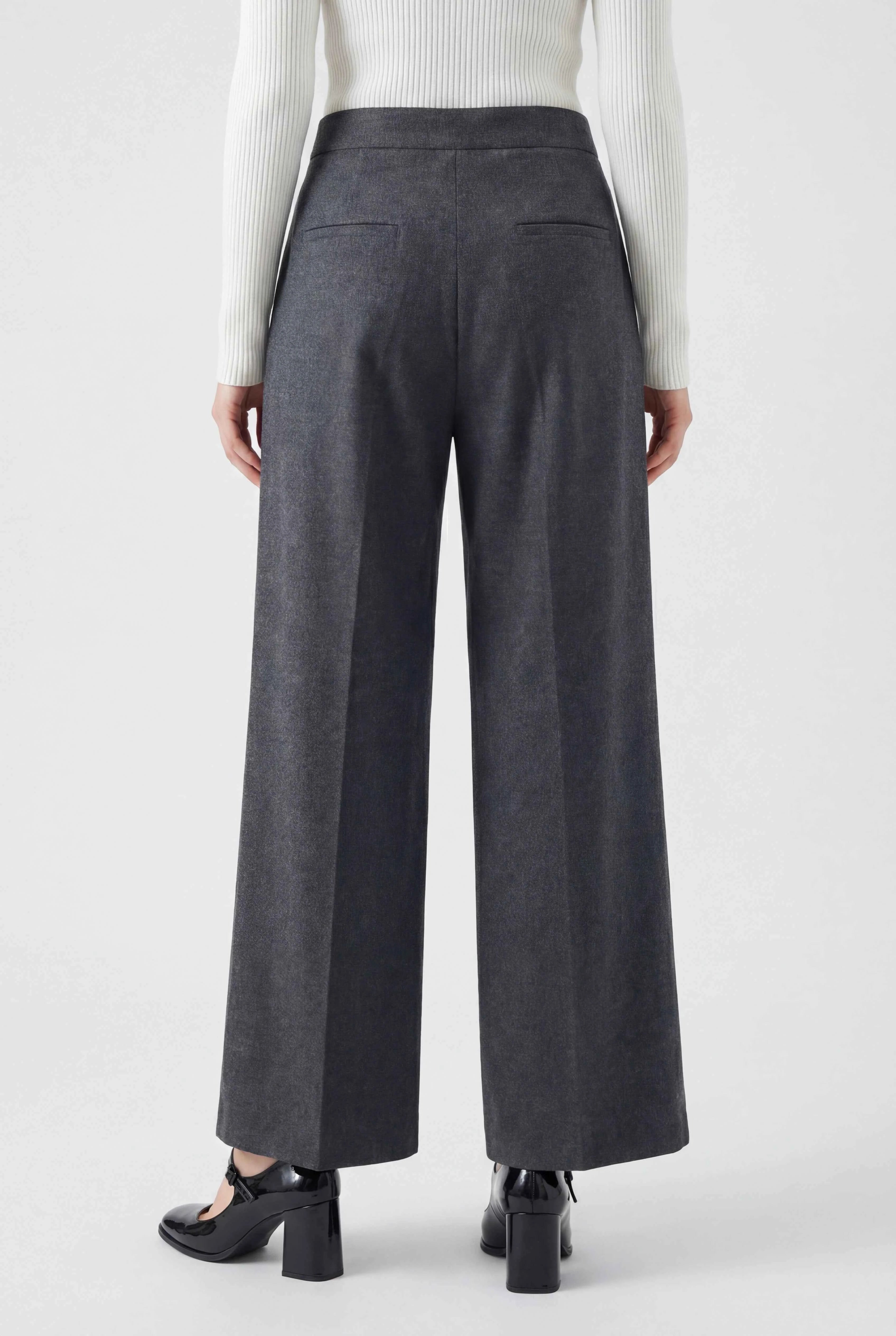 Victoria high-waisted gray trousers by Lumina Wear featuring tailored fit and elegant draping, shown on a model.